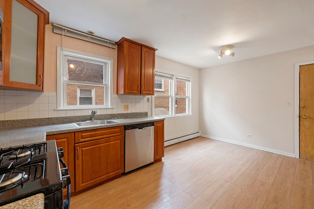 6248 W Montrose Ave Unit 1R, Chicago, IL 60634 - kitchen with stainless steel dishwasher, a sink, baseboard heating, gas range, and brown cabinets