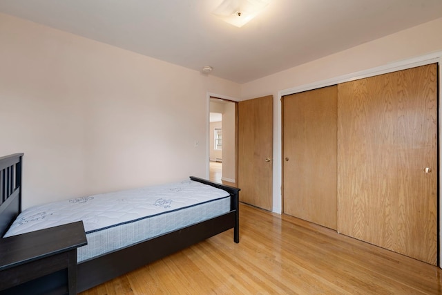 6248 W Montrose Ave Unit 1R, Chicago, IL 60634 - unfurnished bedroom with light wood-style flooring and a closet