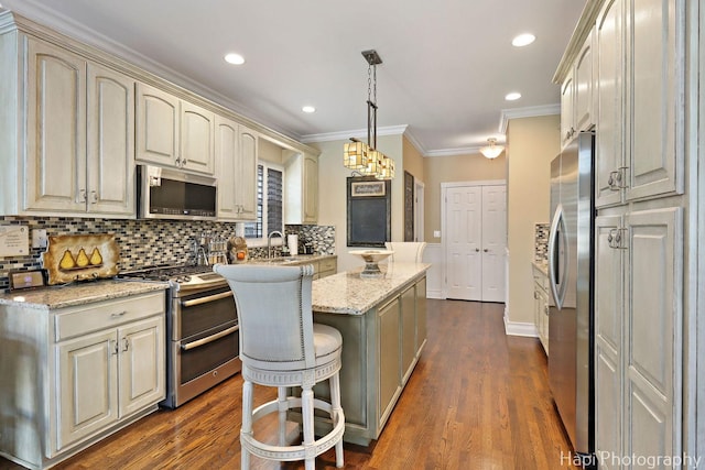 3334 N Odell Ave, Chicago, IL 60634 - kitchen with stainless steel appliances, a kitchen island, dark wood-type flooring, tasteful backsplash, and ornamental molding