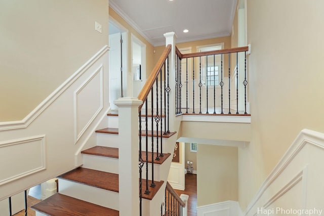 3334 N Odell Ave, Chicago, IL 60634 - staircase with crown molding, a wainscoted wall, recessed lighting, and a decorative wall
