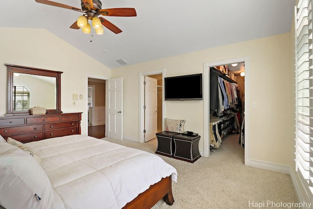 3334 N Odell Ave, Chicago, IL 60634 - bedroom with a spacious closet, vaulted ceiling, light colored carpet, a closet, and baseboards