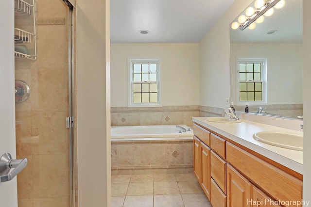 3334 N Odell Ave, Chicago, IL 60634 - full bath featuring tile patterned flooring, a garden tub, double vanity, a shower stall, and healthy amount of natural light