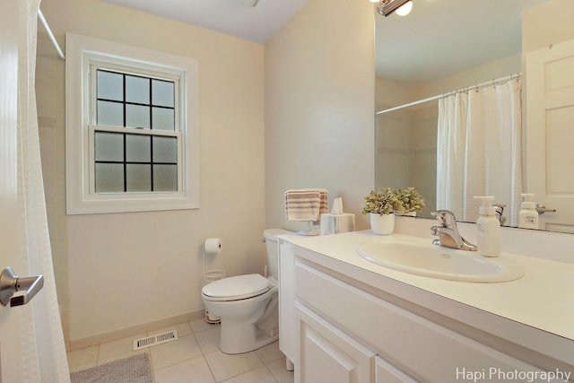 3334 N Odell Ave, Chicago, IL 60634 - bathroom featuring tile patterned floors, vanity, toilet, curtained shower, and baseboards