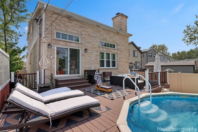 3334 N Odell Ave, Chicago, IL 60634 - rear view of house with a deck, an outdoor hangout area, a chimney, brick siding, and entry steps