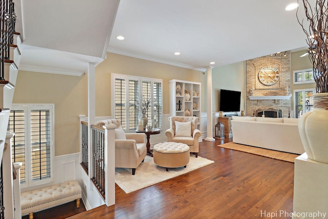 3334 N Odell Ave, Chicago, IL 60634 - living room featuring a fireplace, wainscoting, wood finished floors, crown molding, and recessed lighting