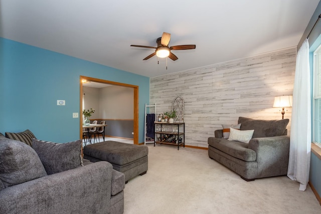 6809 Normandy Dr, Spring Grove, IL 60081 - living area featuring ceiling fan, carpet floors, an accent wall, baseboards, and wood walls