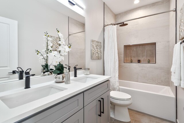 3450 N Central Ave, Chicago, IL 60634 - full bath with double vanity, shower / bathtub combination with curtain, toilet, and wood finished floors