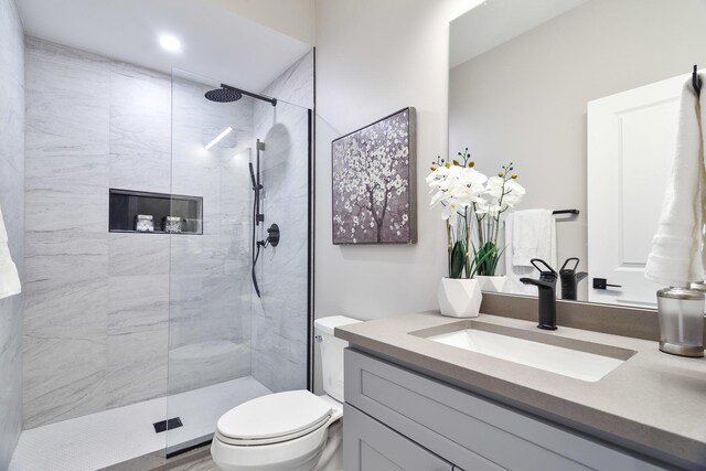 3450 N Central Ave, Chicago, IL 60634 - bathroom featuring vanity, toilet, and a walk in shower