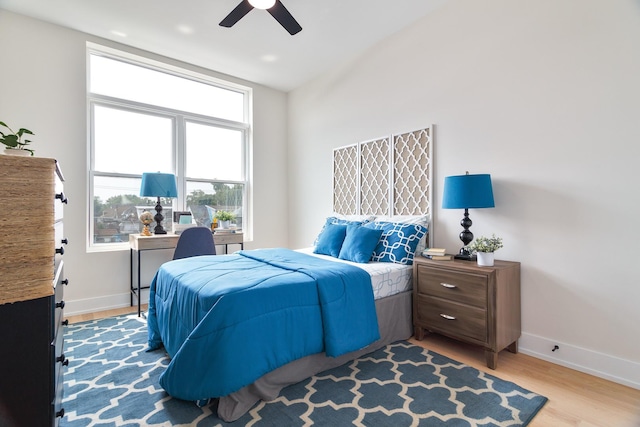 3450 N Central Ave, Chicago, IL 60634 - bedroom featuring baseboards, wood finished floors, and ceiling fan