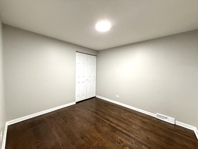 11724 S Loomis St, Chicago, IL 60643 - unfurnished room featuring baseboards and dark wood-style flooring