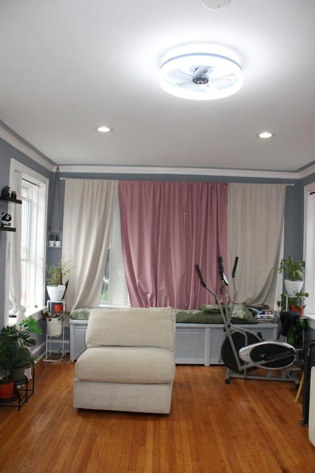 2102 Gunderson Ave, Berwyn, IL 60402 - living area featuring radiator, wood finished floors, ornamental molding, and recessed lighting