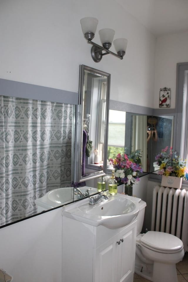 2102 Gunderson Ave, Berwyn, IL 60402 - bathroom featuring radiator and vanity