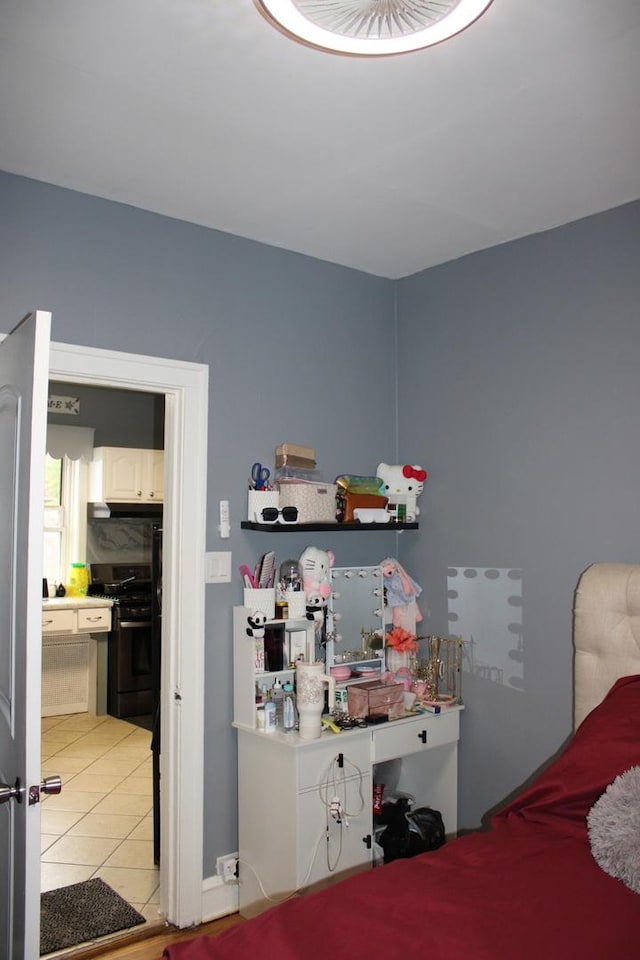 2102 Gunderson Ave, Berwyn, IL 60402 - bedroom with light tile patterned floors and ensuite bath