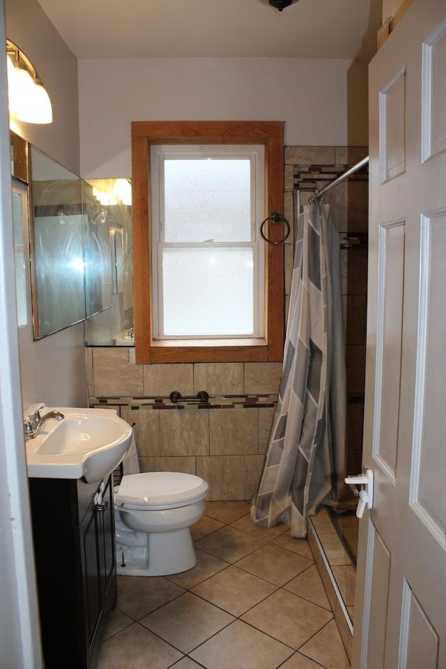 2102 Gunderson Ave, Berwyn, IL 60402 - full bathroom with tile patterned flooring, vanity, a shower stall, and tile walls