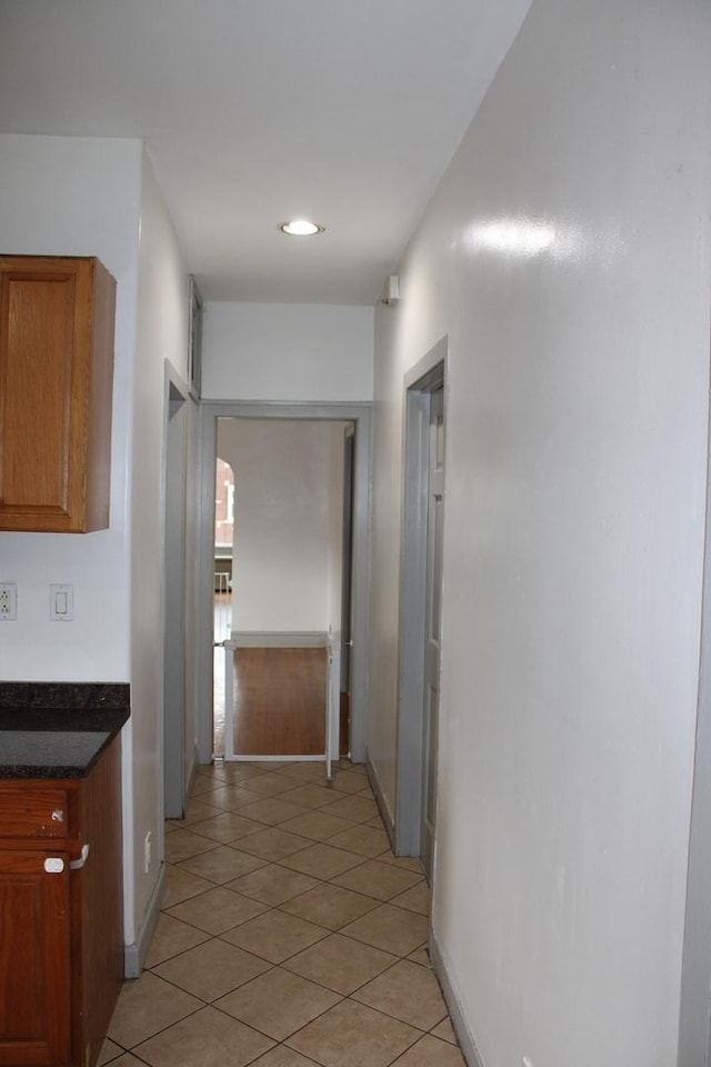 2102 Gunderson Ave, Berwyn, IL 60402 - hallway with light tile patterned floors and baseboards