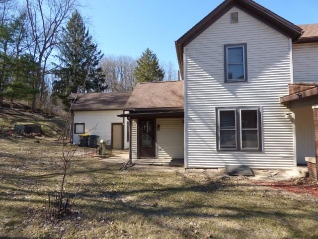 516 Spring St, Galena, IL 61036 - back of house with a lawn and a shingled roof