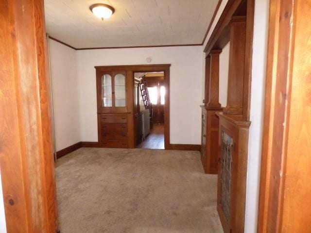 516 Spring St, Galena, IL 61036 - corridor featuring light carpet, baseboards, and crown molding