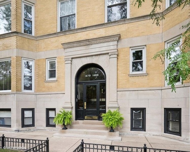 1466 W Warner Ave Unit 2W, Chicago, IL 60613 - view of exterior entry featuring brick siding and stone siding