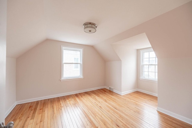 5651 N Osceola Ave, Chicago, IL 60631 - additional living space with hardwood / wood-style flooring, vaulted ceiling, and baseboards