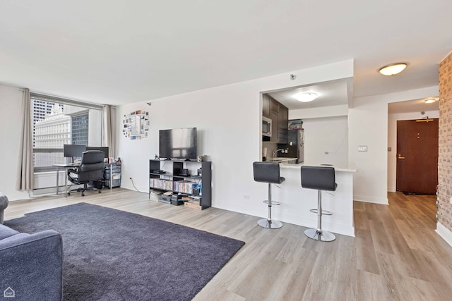 440 N Wabash Ave Unit 2008, Chicago, IL 60611 - living room with a desk, light wood-style floors, and baseboards