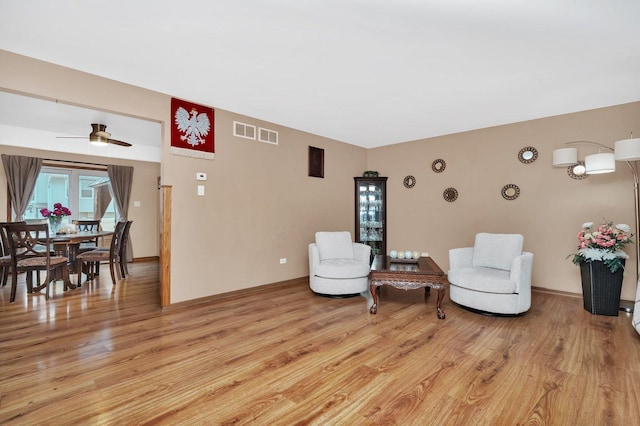 2111 Hastings Dr, Plainfield, IL 60586 - living area featuring light wood finished floors and ceiling fan