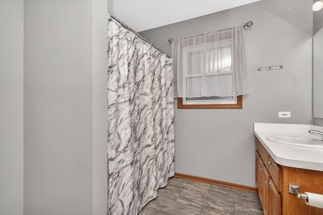 2111 Hastings Dr, Plainfield, IL 60586 - full bathroom with vanity, a shower with shower curtain, and baseboards