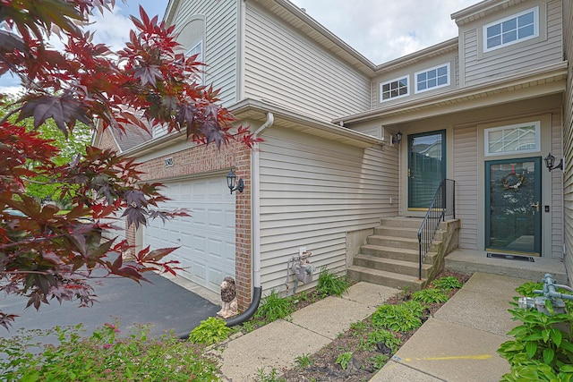 3503 Blue Ridge Ct, Carpentersville, IL 60110 - view of exterior entry with an attached garage and brick siding