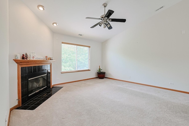3503 Blue Ridge Ct, Carpentersville, IL 60110 - unfurnished living room featuring carpet floors, a tiled fireplace, ceiling fan, recessed lighting, and lofted ceiling