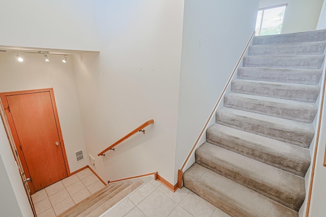 3503 Blue Ridge Ct, Carpentersville, IL 60110 - staircase with rail lighting and tile patterned floors