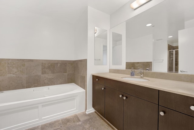 65 E Monroe St Unit 4203, Chicago, IL 60603 - bathroom featuring a bath, vanity, and a stall shower