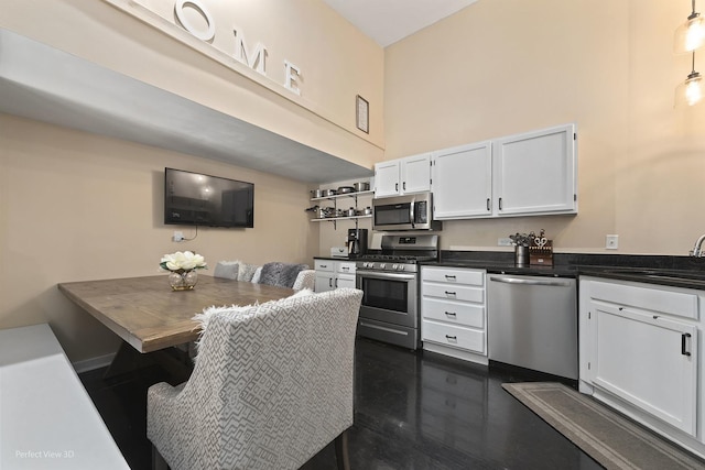 7612 W Saint Francis Rd Unit 7612, Frankfort, IL 60423 - kitchen with appliances with stainless steel finishes, a sink, dark countertops, white cabinetry, and open shelves