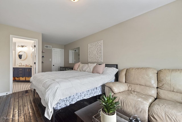 7612 W Saint Francis Rd Unit 7612, Frankfort, IL 60423 - bedroom with dark wood finished floors, ensuite bath, and a sink