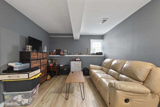 7612 W Saint Francis Rd Unit 7612, Frankfort, IL 60423 - living room featuring light wood-style flooring and beam ceiling