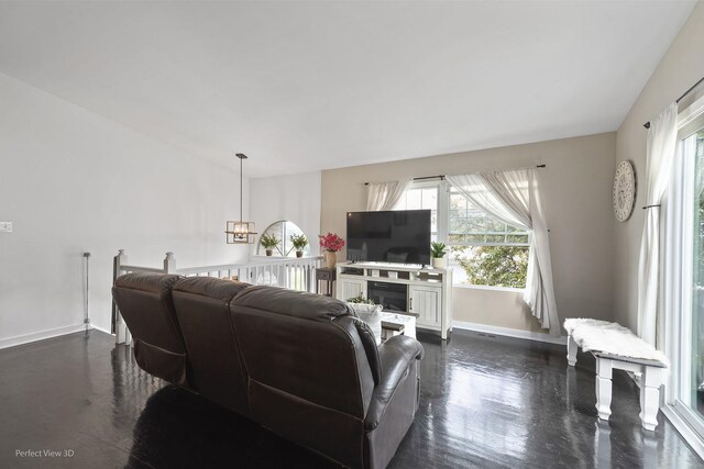 7612 W Saint Francis Rd Unit 7612, Frankfort, IL 60423 - living area featuring plenty of natural light, baseboards, a fireplace, and a chandelier