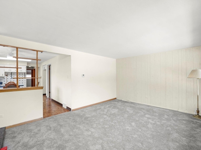 10324 S Sacramento Ave, Chicago, IL 60655 - empty room featuring carpet flooring and wooden walls