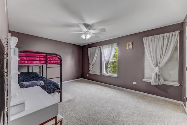 1715 Ivy Ln, Montgomery, IL 60538 - unfurnished bedroom with carpet floors, baseboards, and a ceiling fan