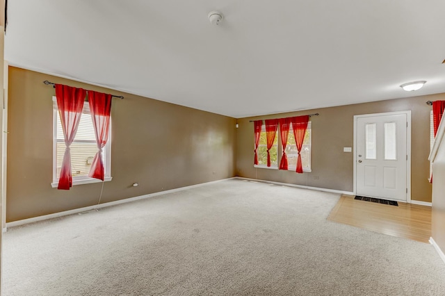 1715 Ivy Ln, Montgomery, IL 60538 - entryway with carpet and baseboards