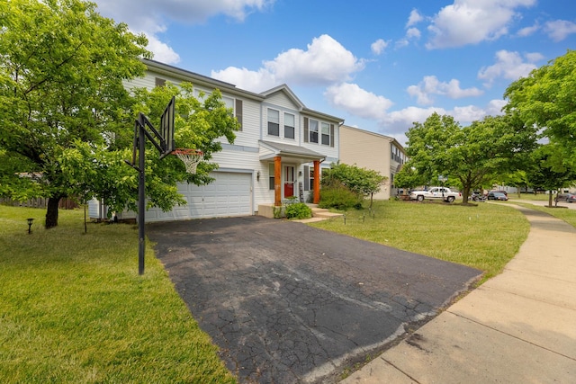 1715 Ivy Ln, Montgomery, IL 60538 - view of front of home featuring an attached garage, a front yard, and asphalt driveway
