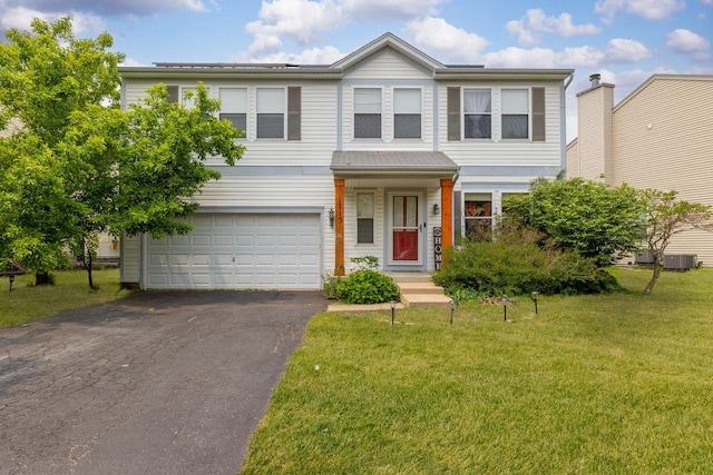 1715 Ivy Ln, Montgomery, IL 60538 - view of front of home with a garage, a front lawn, driveway, and central AC unit