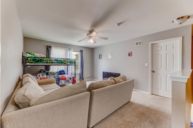 1715 Ivy Ln, Montgomery, IL 60538 - living room featuring ceiling fan, light carpet, and baseboards