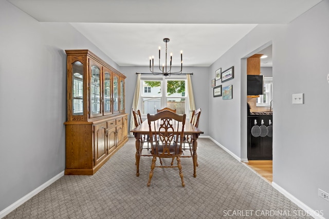1630 Lois Ann Ln, Naperville, IL 60563 - dining space featuring a chandelier and light colored carpet