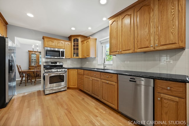 1630 Lois Ann Ln, Naperville, IL 60563 - kitchen featuring stainless steel appliances, light wood-style flooring, glass insert cabinets, tasteful backsplash, and recessed lighting