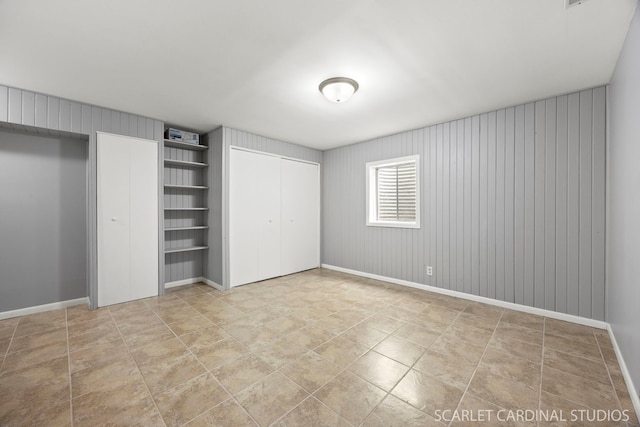 1630 Lois Ann Ln, Naperville, IL 60563 - unfurnished bedroom with multiple closets and wooden walls