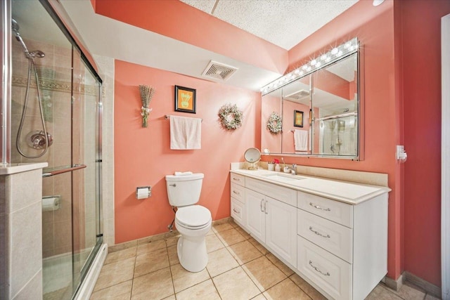 770 Pearson St Unit 604, Des Plaines, IL 60016 - bathroom featuring toilet, a stall shower, vanity, tile patterned floors, and baseboards