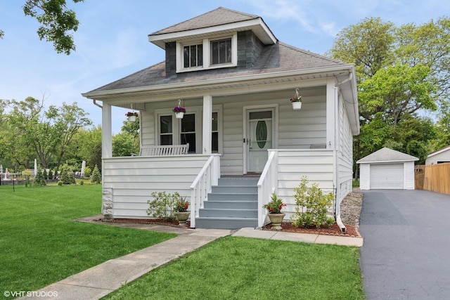 420 Blackhawk Dr, Westmont, IL 60559 - bungalow-style house with a porch, a garage, an outdoor structure, asphalt driveway, and a front yard