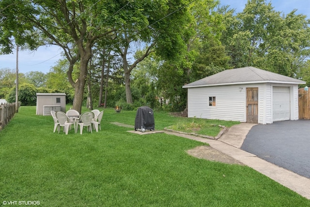 420 Blackhawk Dr, Westmont, IL 60559 - view of yard with an outbuilding, driveway, and a detached garage