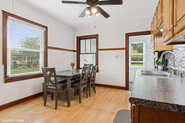 420 Blackhawk Dr, Westmont, IL 60559 - dining room with light wood-type flooring, ceiling fan, and baseboards