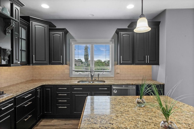 4 Emerald Crest Ct, Bloomington, IL 61705 - kitchen featuring stainless steel dishwasher, dark cabinetry, recessed lighting, hanging light fixtures, and wood finished floors