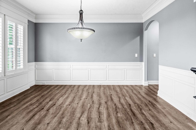 4 Emerald Crest Ct, Bloomington, IL 61705 - unfurnished room featuring arched walkways, healthy amount of natural light, crown molding, a wainscoted wall, and dark wood-style floors