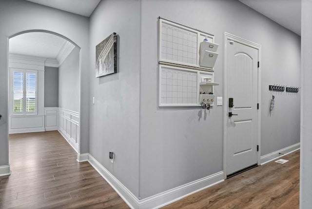 4 Emerald Crest Ct, Bloomington, IL 61705 - corridor featuring arched walkways, wood finished floors, ornamental molding, and a wainscoted wall
